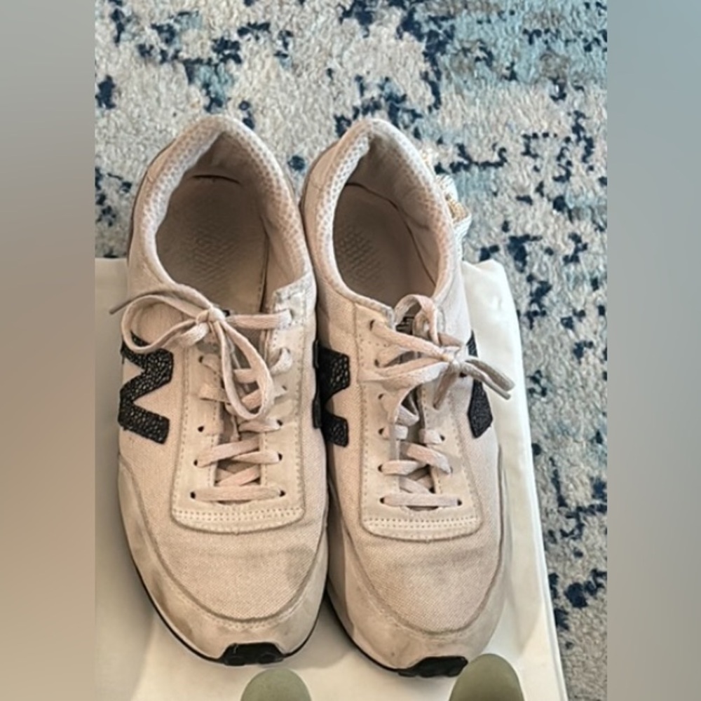 Pink and black new balance sneakers